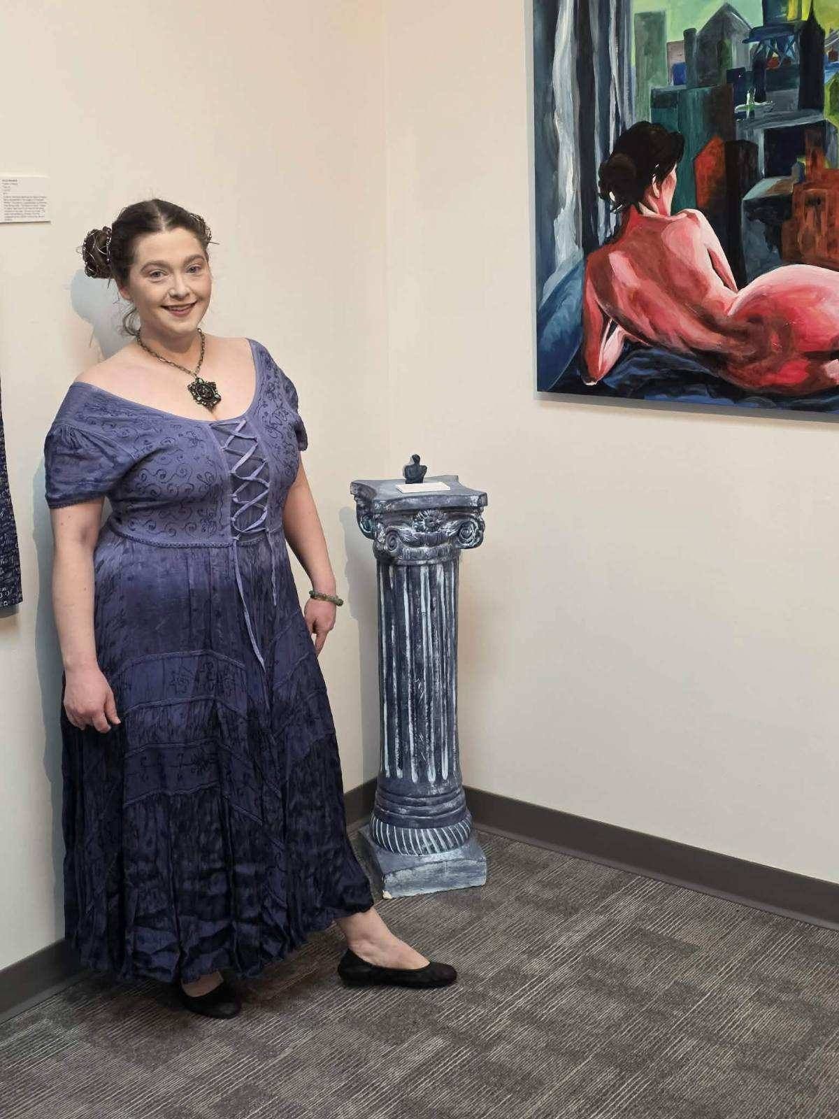 Payal Agarwal beside The Heat of Cold Distance at the She Holds These Truths opening, Arts for Vets, Grand Forks ND, March 2026. Photo by Arts for Vets.