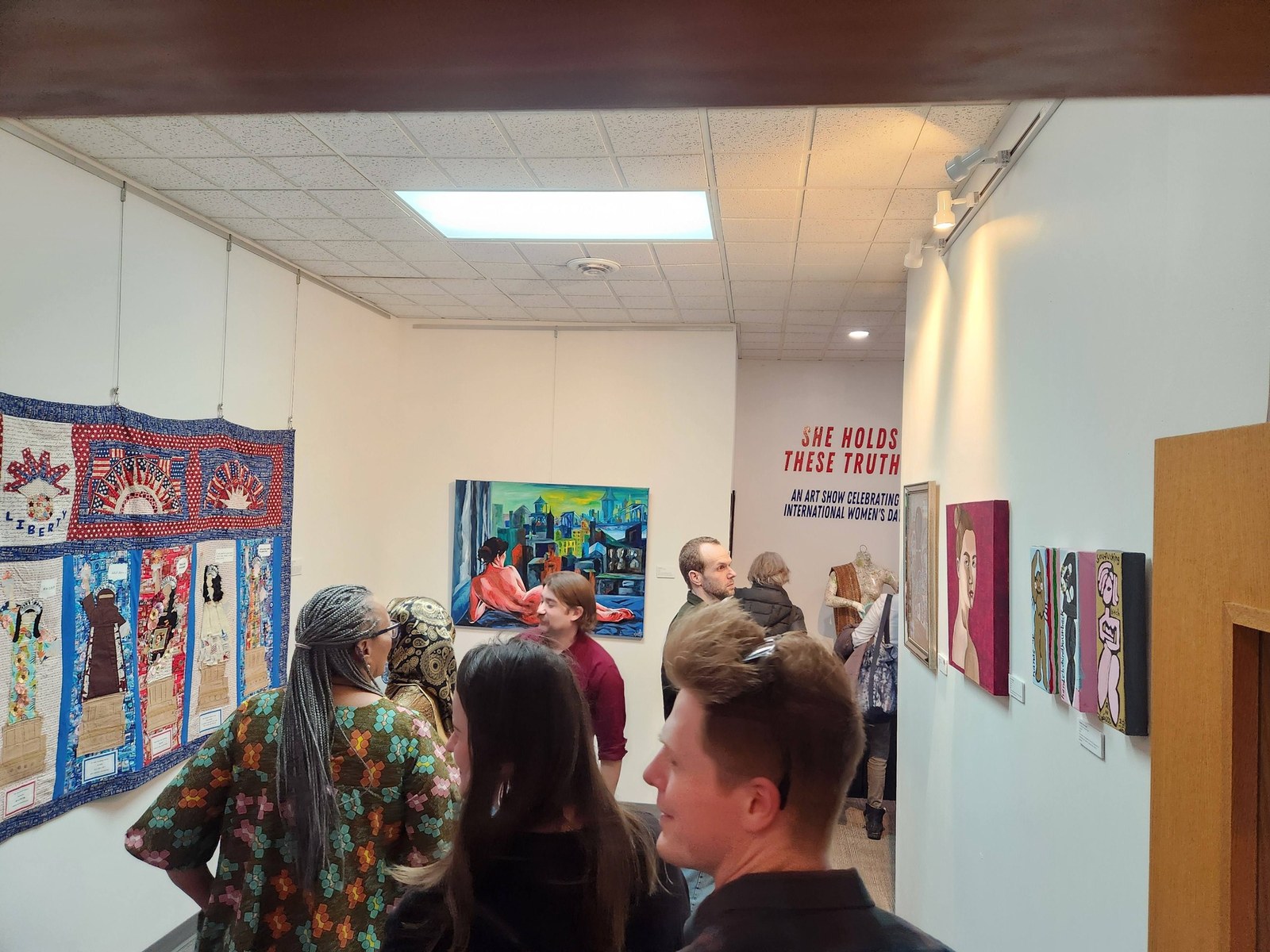 Installation view of the She Holds These Truths group exhibition at Arts for Vets, Grand Forks ND, March 2026. Photo by Arts for Vets.