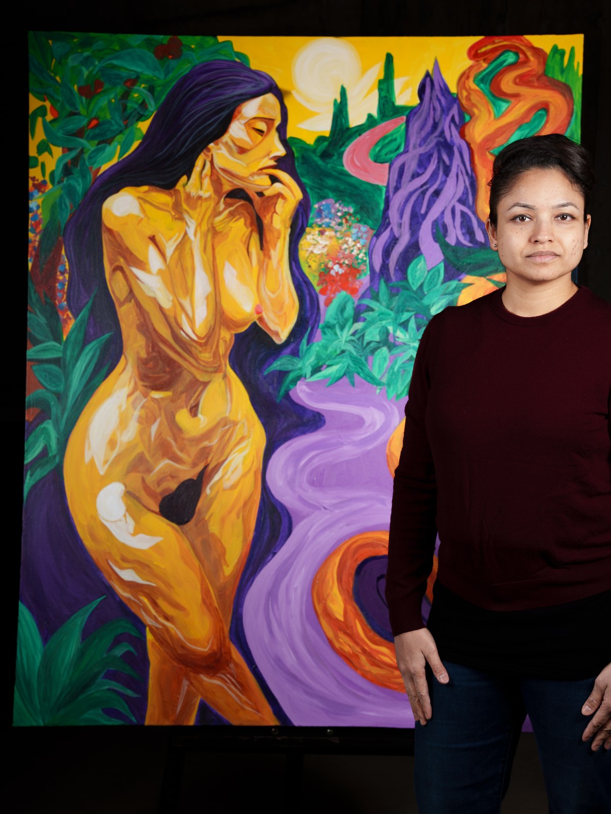 Payal Agarwal stands beside the finished canvas, composed and unflinching. The Garden of Eden, 2026, by Payal Agarwal.