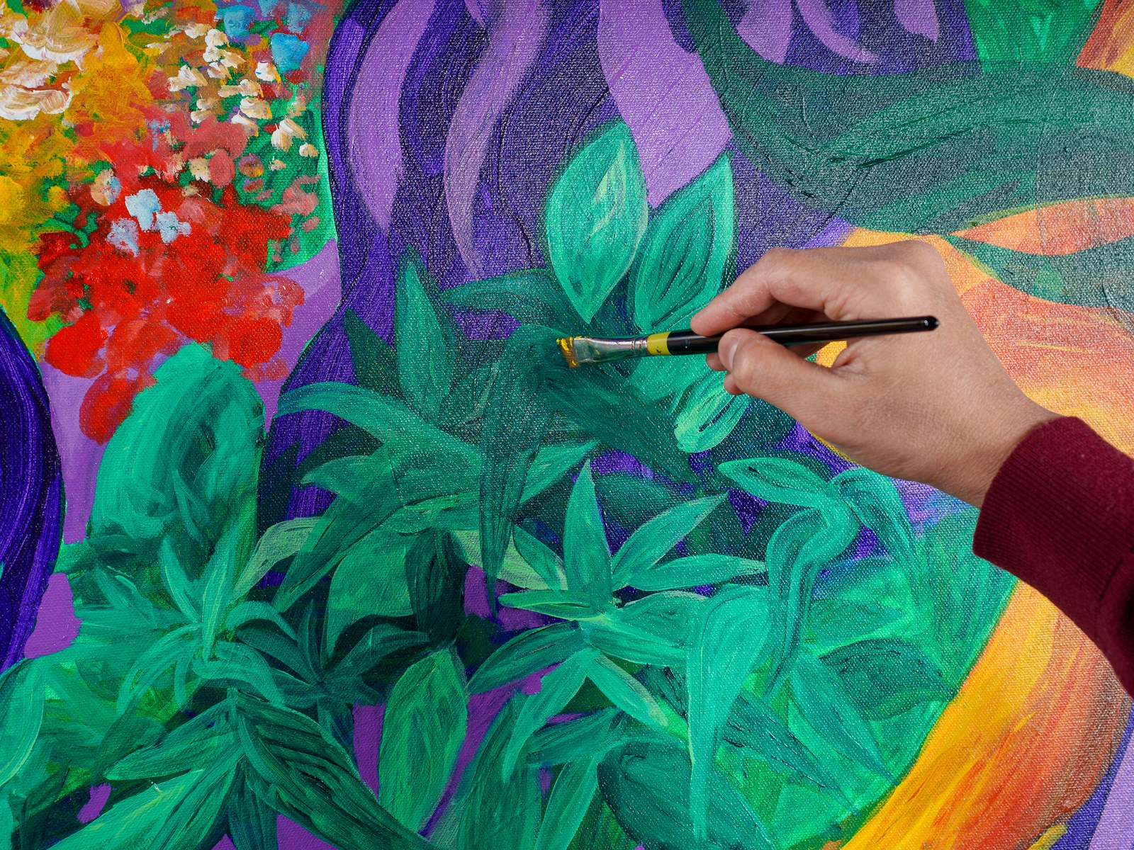 Brush meets leaf: Payal layers verdant strokes near the blossoming corruption. The Garden of Eden, 2026, by Payal Agarwal.