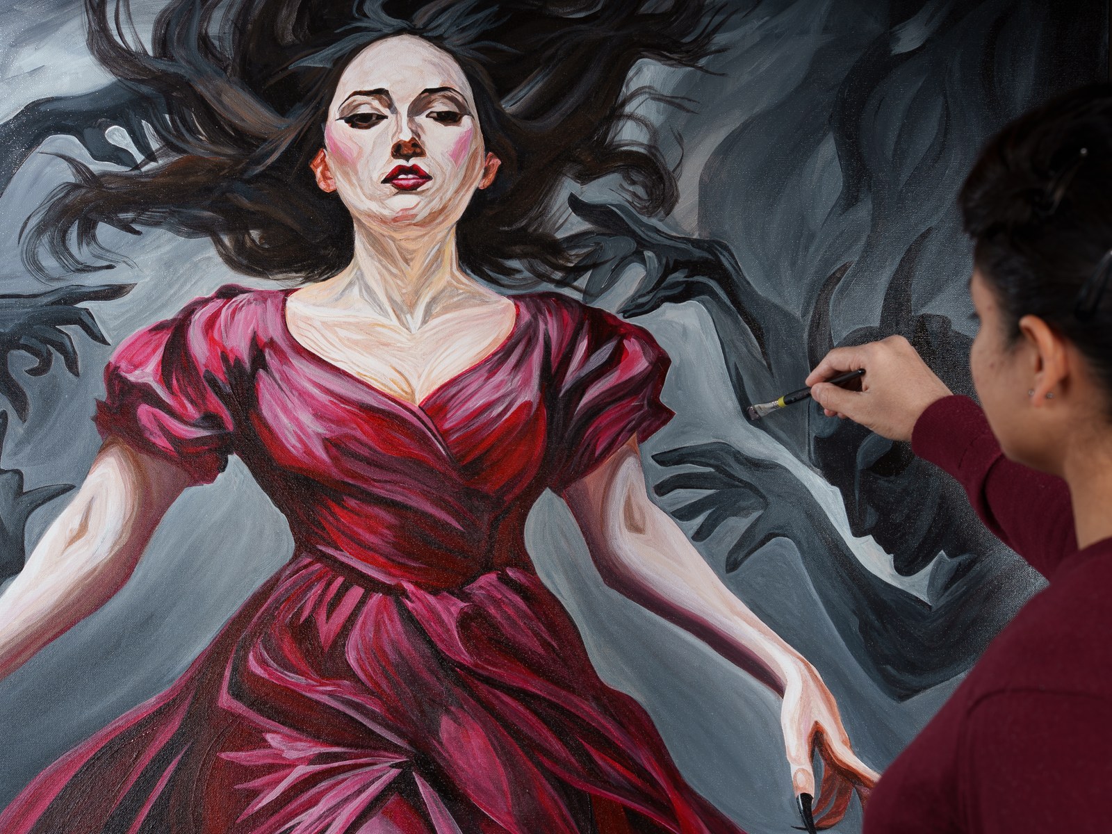 The upper half of the composition centers the figure as the artist's hand brushes a shadow nearby. The Gravity of Touch, 2026, by Payal Agarwal.