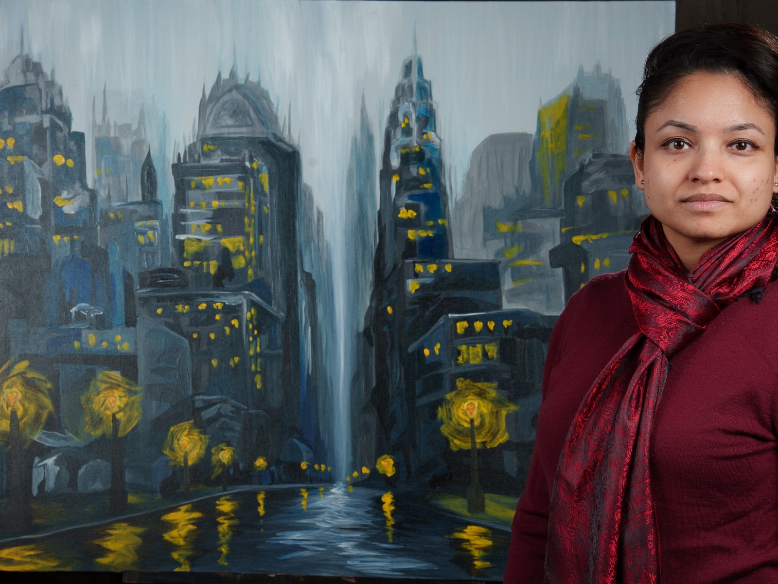 Payal Agarwal beside her completed cityscape of persistent, unattended light. The Lights Outlasted Everyone, 2026, by Payal Agarwal.