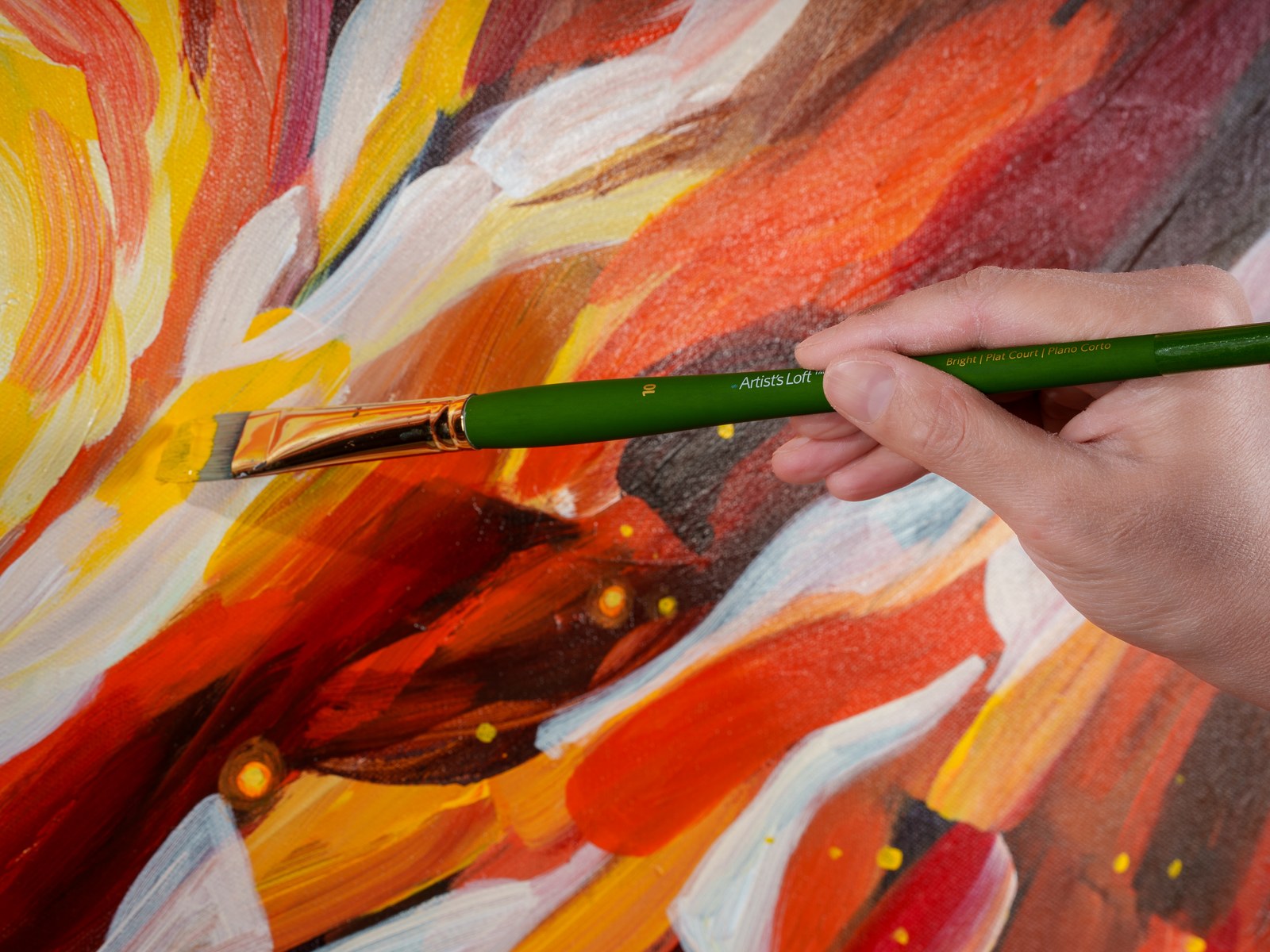 Payal Agarwal's hand mid-stroke, flat brush placing white light over the spiral. You Are the Reason Stars Form, 2026, by Payal Agarwal.